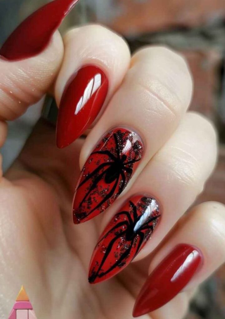 Bold-stiletto-red-and-black-spider-design-nails-coated-in-glossy-crimson-polish-with-dark-glitter-underlays-and-dramatic-long-legged-black-spiders