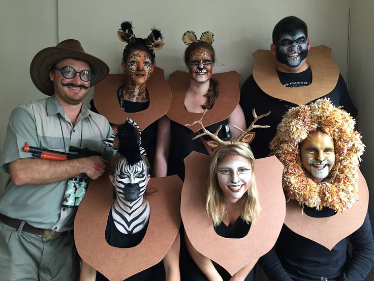 group-dressed-as-mounted-safari-animal-trophies-with-a-hunter-and-painted-faces
