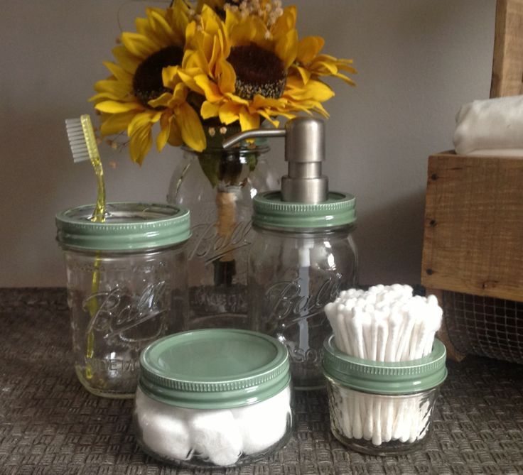 clear-mason-jar-bathroom-organizers-holding-cotton-balls-swabs-and-soap-dispenser
