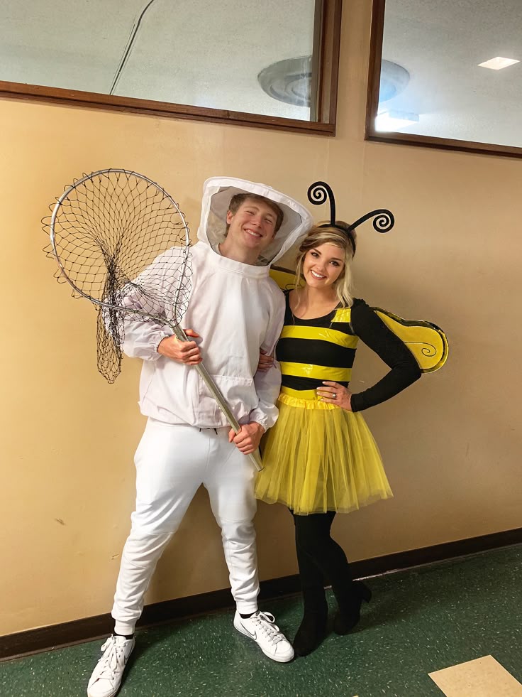 smiling-couple-in-a-diy-bee-and-beekeeper-costume-with-a-net-and-bumblebee-wings