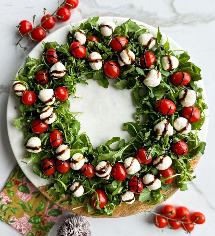 caprese-salad-wreath-with-cherry-tomatoes-mozzarella-arugula-and-balsamic-glaze