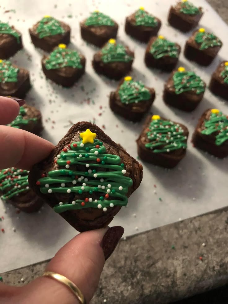 mini-christmas-brownie-bites-decorated-with-green-frosting-trees-and-star-sprinkles-easy-christmas-party-potluck-ideas