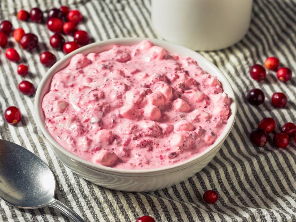 creamy-pink-christmas-cranberry-fluff-salad-in-a-white-bowl