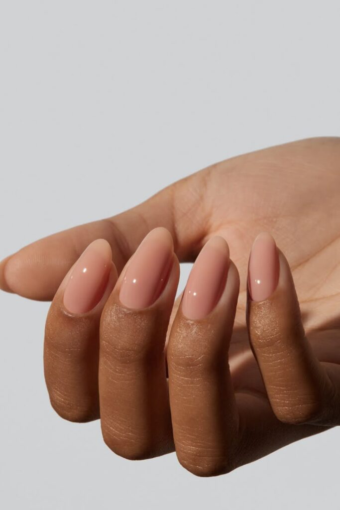 glossy-sheer-peach-nude-almond-nails-with-clean-polished-finish