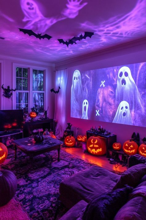 halloween-movie-room-with-purple-mood-lighting-ghost-projections-and-lit-pumpkins