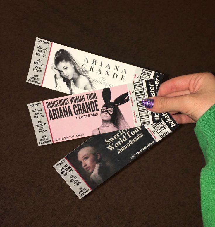 A-hand-holding-three-Ariana-Grande-concert-tickets-for-The-Honeymoon,-Dangerous-Woman,-and-Sweetener-tours.