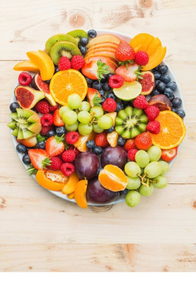 colorful-fruit-platter-filled-with-sliced-kiwi-strawberries-grapes-oranges-and-figs