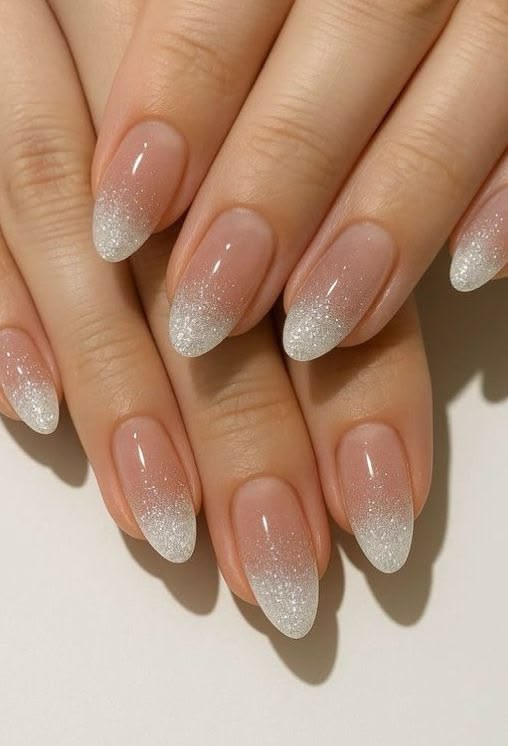 silver-fine-glitter-tip-ombre-almond-nails-with-glossy-nude-base