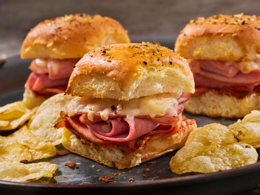 warm-ham-and-swiss-cheese-party-sliders-served-with-potato-chips