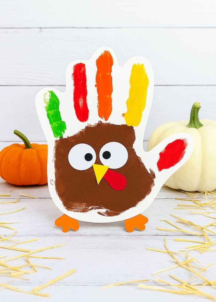 handprint-turkey-craft-made-with-brown-orange-yellow-red-and-green-paint
