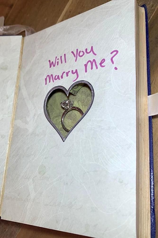 diamond-engagement-ring-hidden-inside-heart-cutout-of-a-book