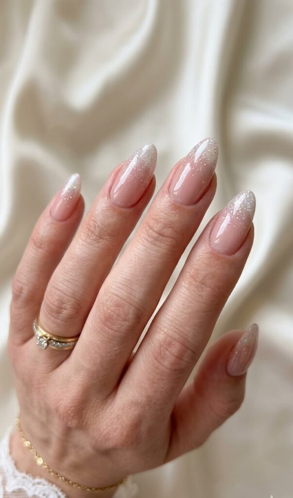 silver-fine-glitter-tip-ombre-almond-nails-with-glossy-nude-base-for-wedding-nails-for-brides 