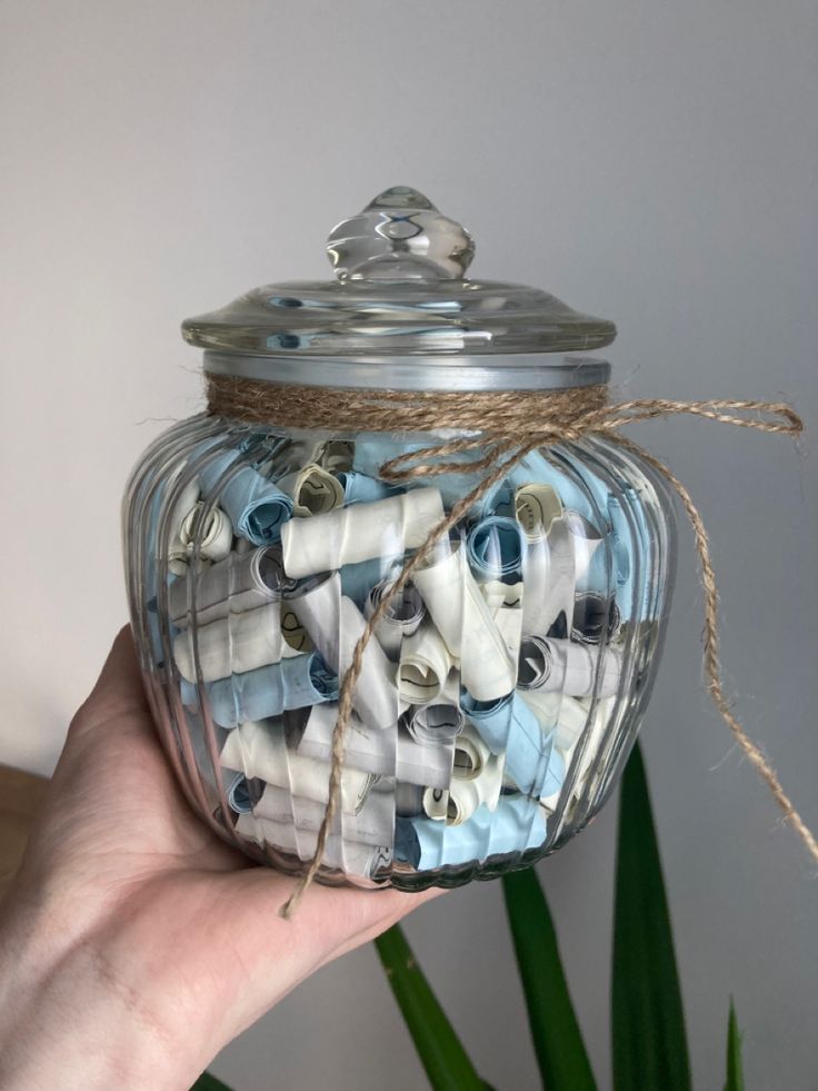 A-glass-"memories"-jar-filled-with-sky-blue-and-white-notes.