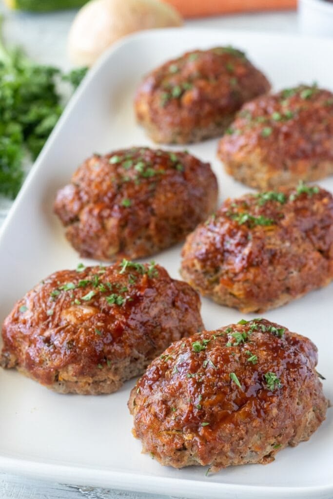 glazed-mini-turkey-meatloaves-arranged-on-a-white-serving-platter