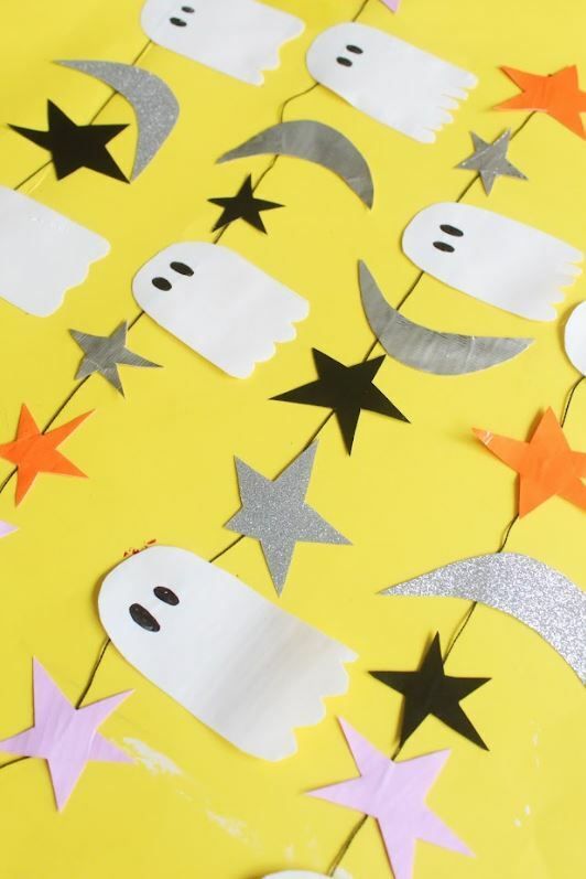 bright-yellow-background-with-white-ghost-silver-moon-and-star-garland
