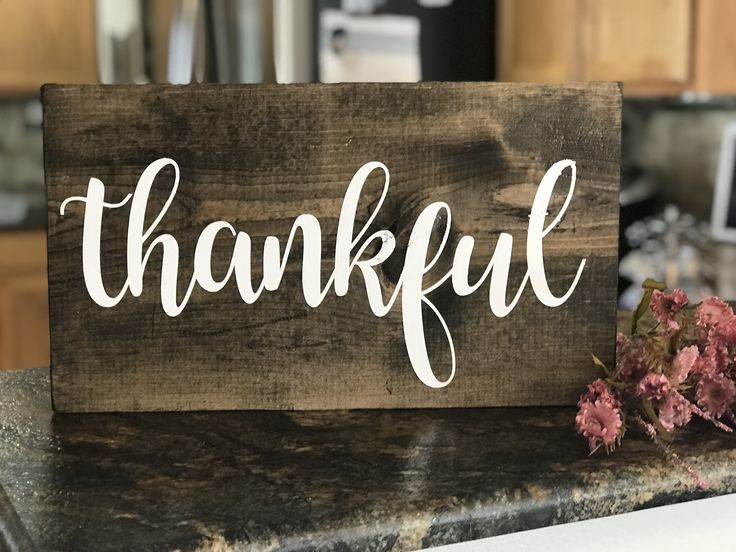 rustic-dark-wood-sign-with-thankful-written-in-white-script-lettering-for-thanksgiving-crafts-ideas
