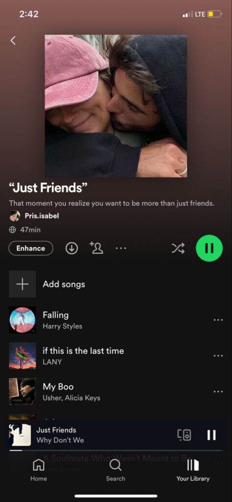 A-mobile-phone-screen-displaying-a-Spotify-playlist-titled-"Just-Friends"-with-a-custom-couple-photo-cover