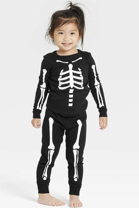 young-child-wearing-a-black-two-piece-skeleton-costume-with-white-bone-prints