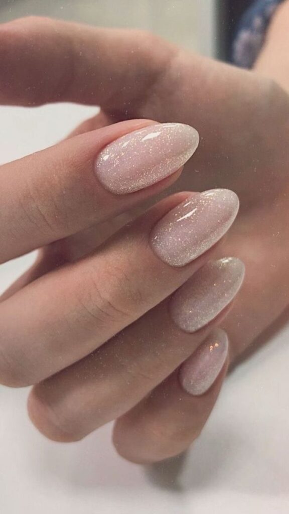 subtle-shimmer-base-nude-almond-nails-with-glossy-finish-for-wedding-nails-for-brides 