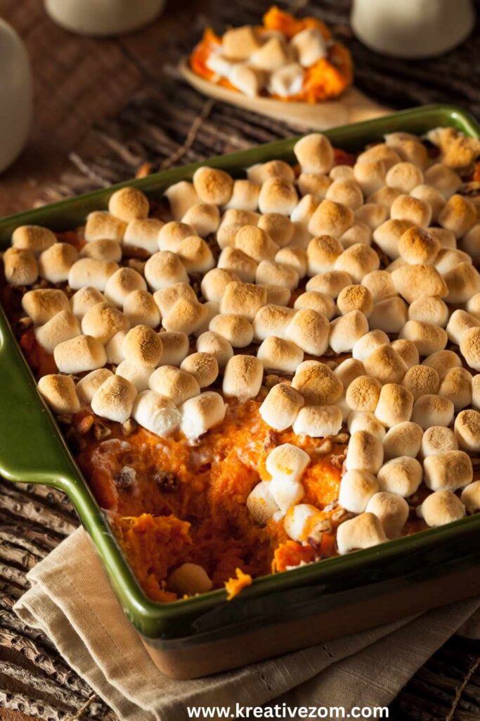 sweet-potato-casserole-topped-with-toasted-marshmallows-in-a-green-baking-dish