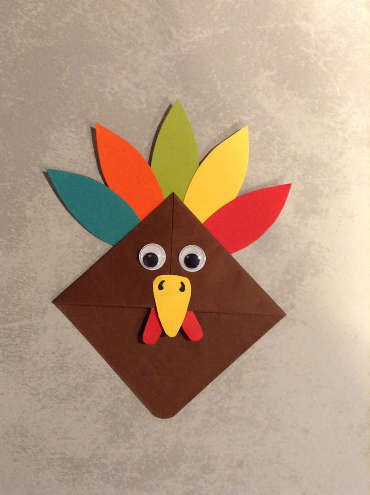 origami-turkey-corner-bookmark-craft-with-googly-eyes-and-colorful-paper-feathers