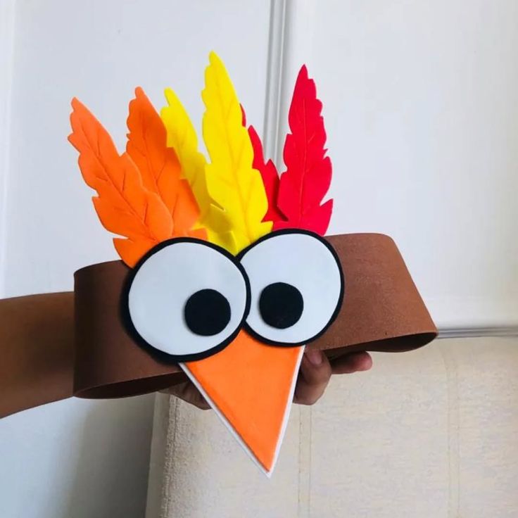 craft-turkey-paper-headband-with-large-eyes-orange-beak-and-colorful-foam-feathers
