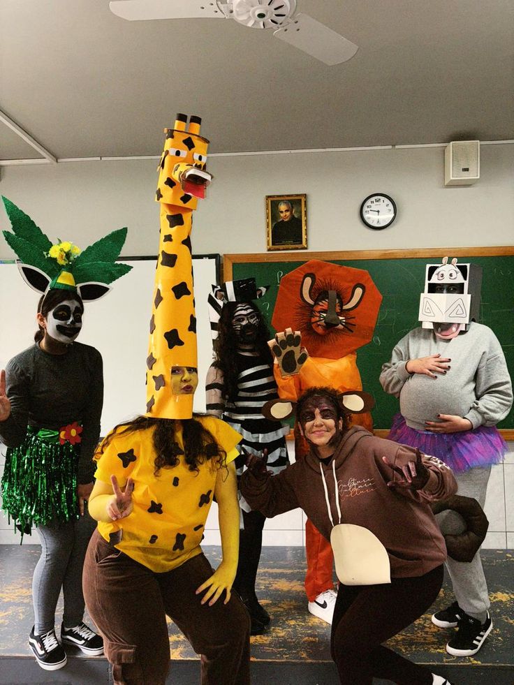 group-dressed-in-diy-madagascar-movie-costumes-featuring-giraffe-lion-hippo-zebra-and-lemur