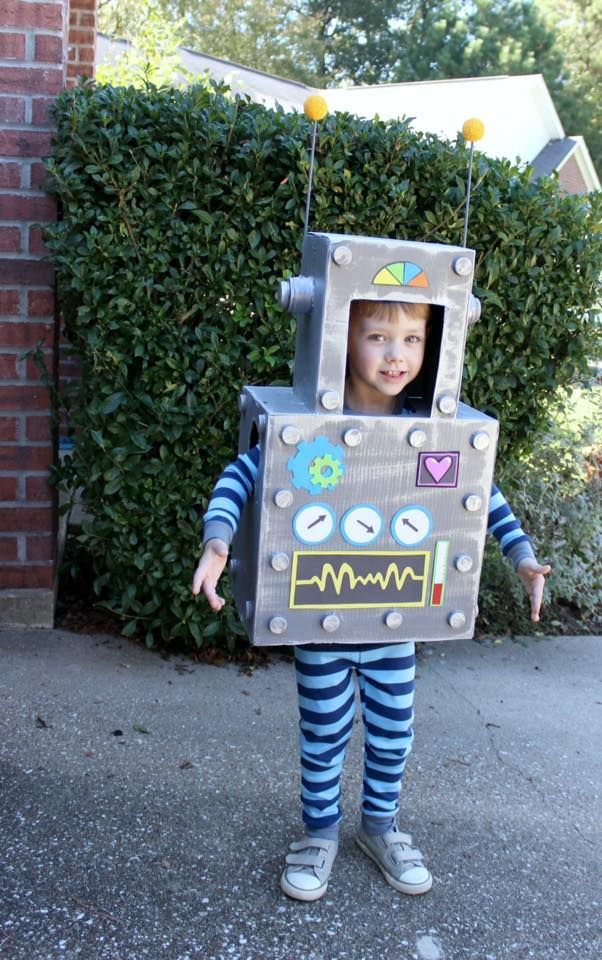 child-wearing-a-homemade-silver-cardboard-robot-costume-with-dials-buttons-and-yellow-antennae