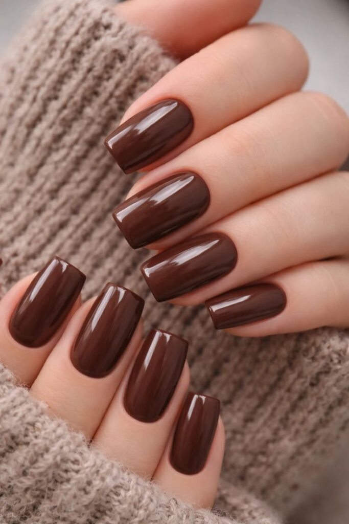 glossy-chocolate-brown-square-nails-with-beige-knit-sweater-sleeve