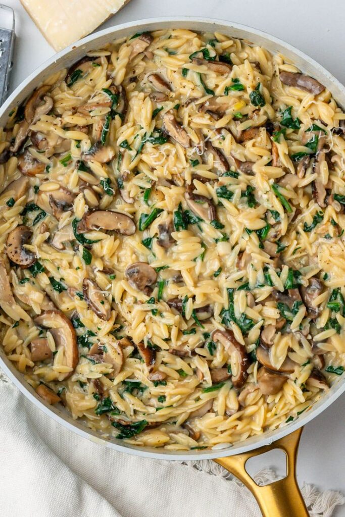creamy-mushroom-and-spinach-orzo-pasta-in-a-skillet