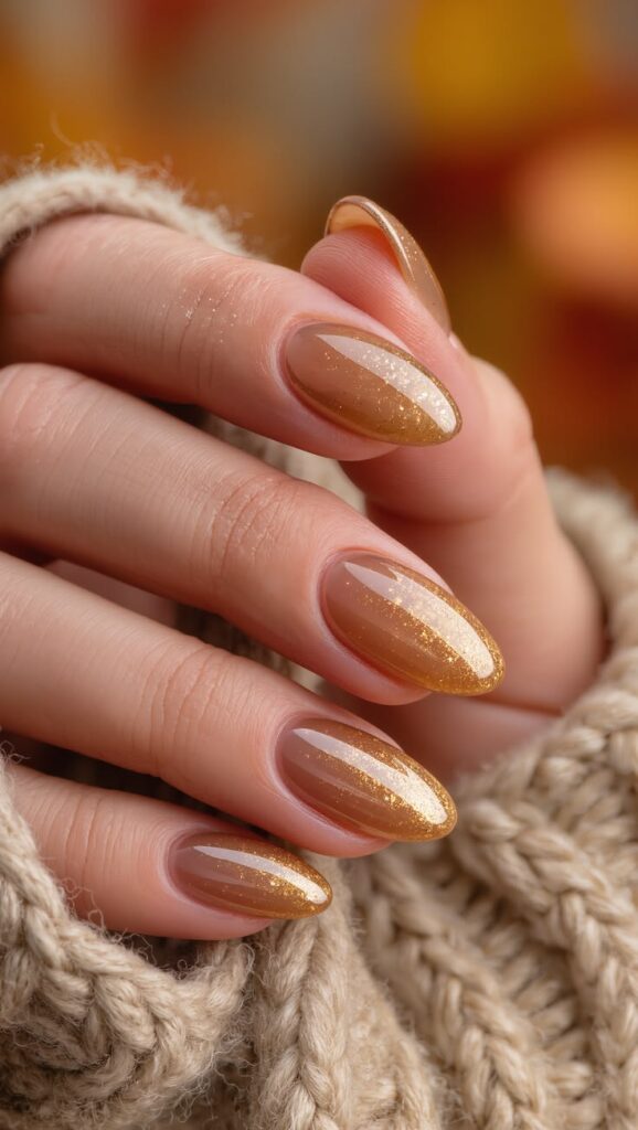 caramel-brown-almond-nails-with-fine-gold-fleck-shimmer-top-coat