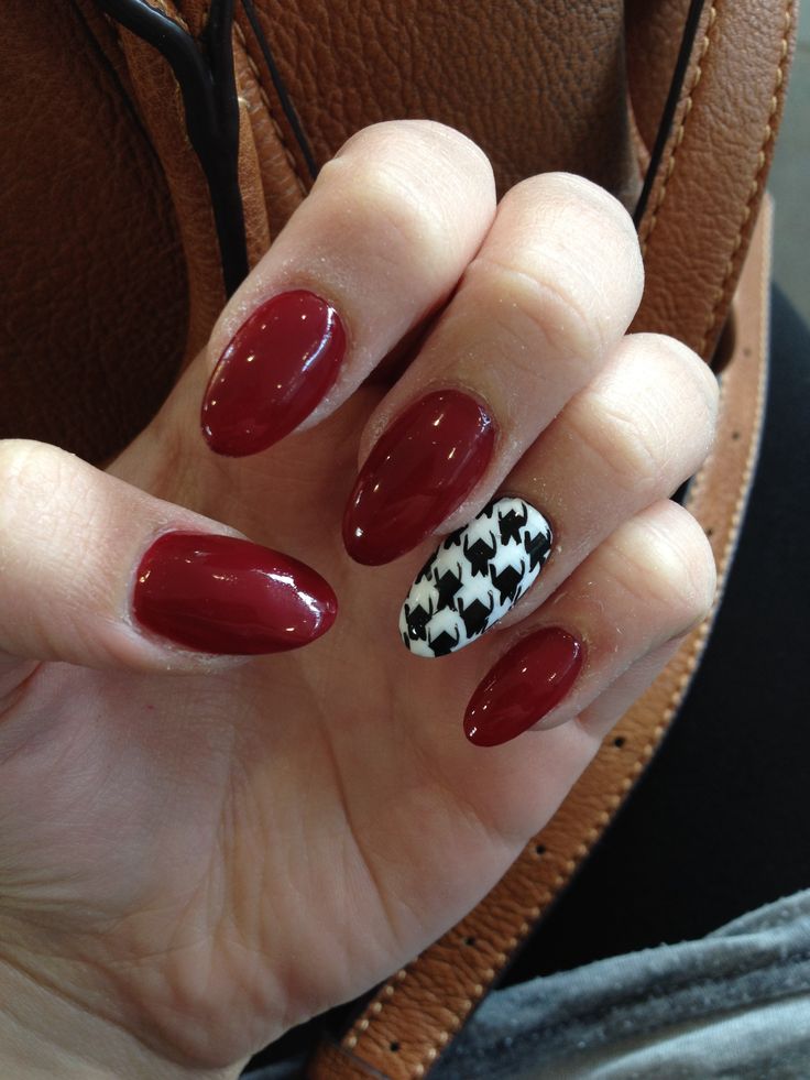 glossy-deep-red-oval-nails-with-black-and-white-houndstooth-accent-nail