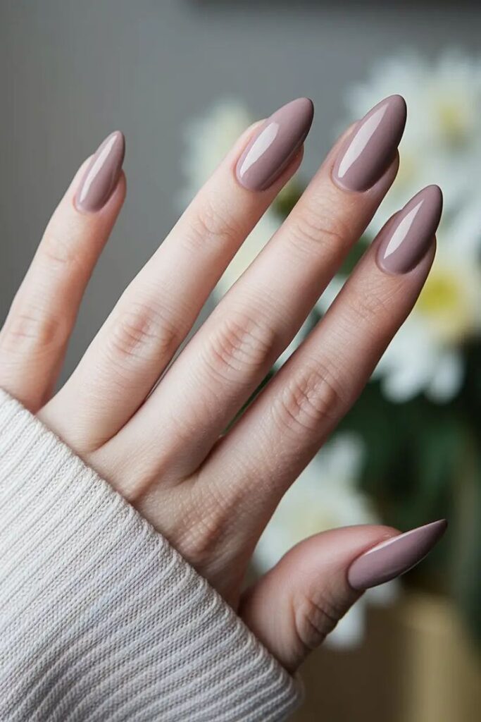 glossy-mocha-mauve-almond-nails-with-white-knit-sweater-sleeve-fall-nail-designs