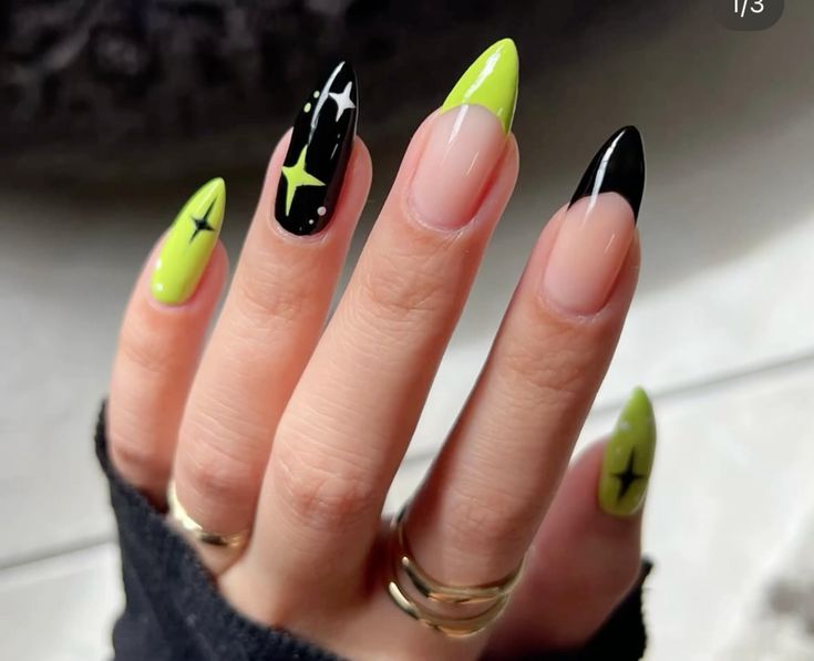 neon-lime-green-and-black-french-tip-halloween-nails-with-starbursts