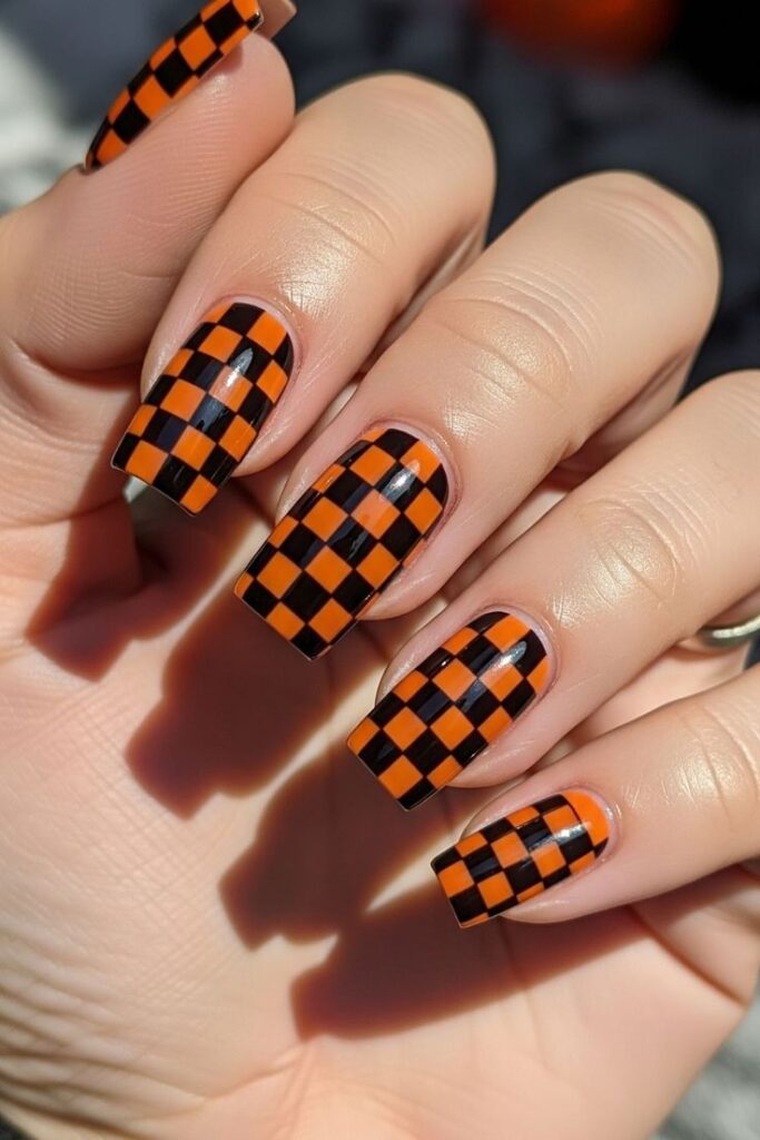 bold-orange-and-black-checkerboard-pattern-halloween-nail-art