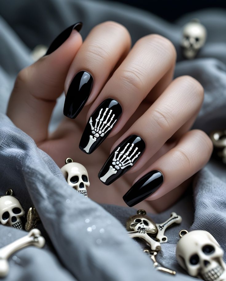 glossy-black-halloween-nails-with-white-skeleton-hand-accent-art