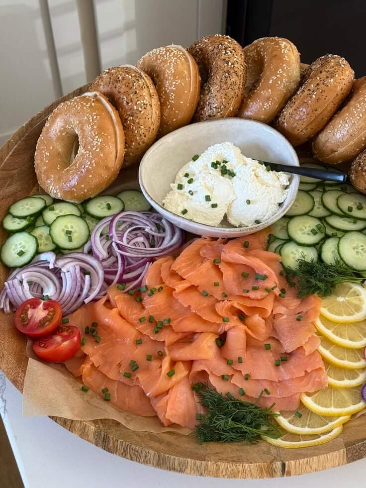 bagel-and-cream-cheese-bar-platter-with-sliced-bagels-smoked-salmon-cream-cheese-cucumber-and-red-onion