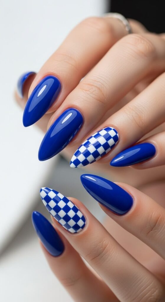 cobalt-blue-almond-nails-with-checkerboard-accent-simple-nail-ideas