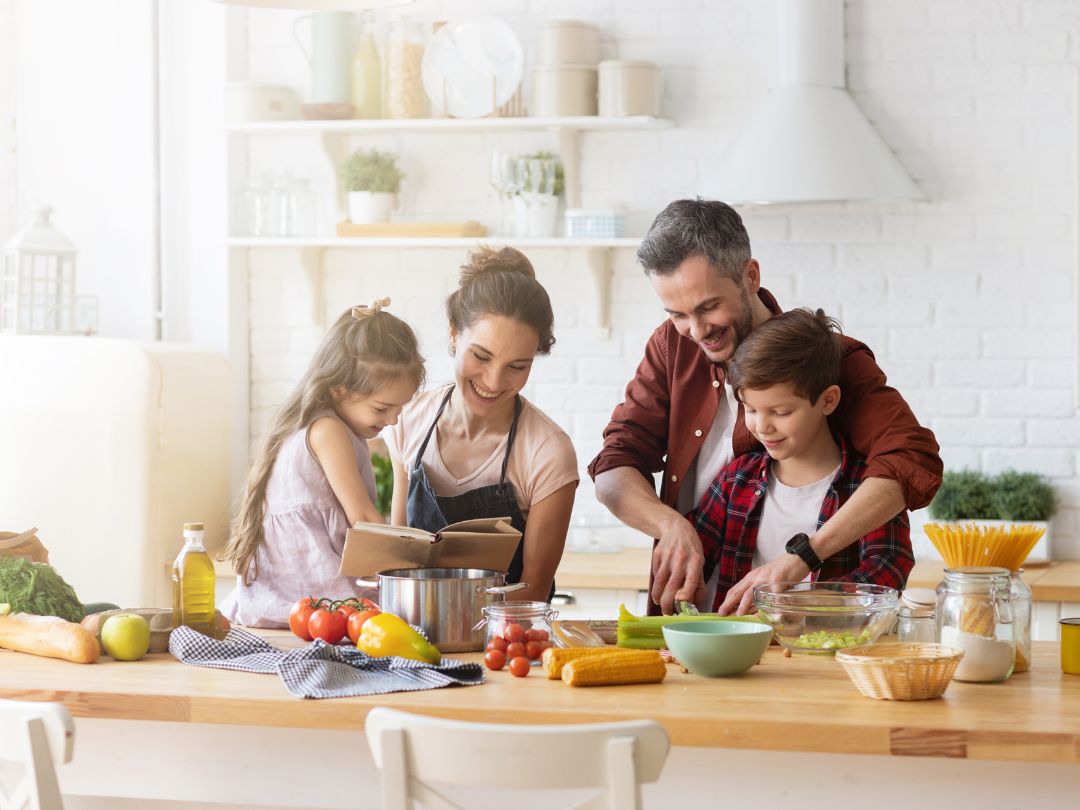happy-family-cooking-a-meal-together-in-a-bright-kitchen