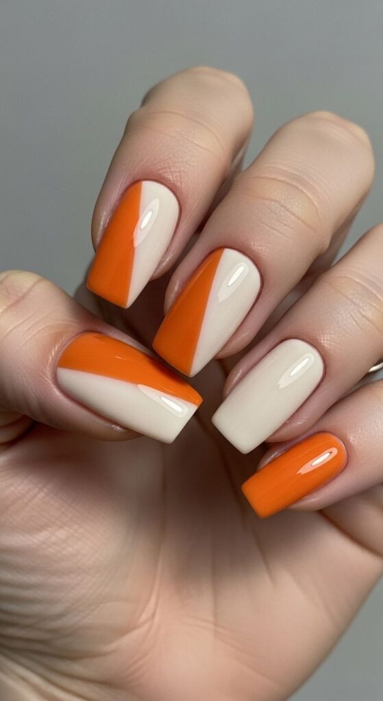 nail-art-photo-of-diagonal-color-block-manicure-featuring-burnt-orange-and-cream-polish-on-squared-nails