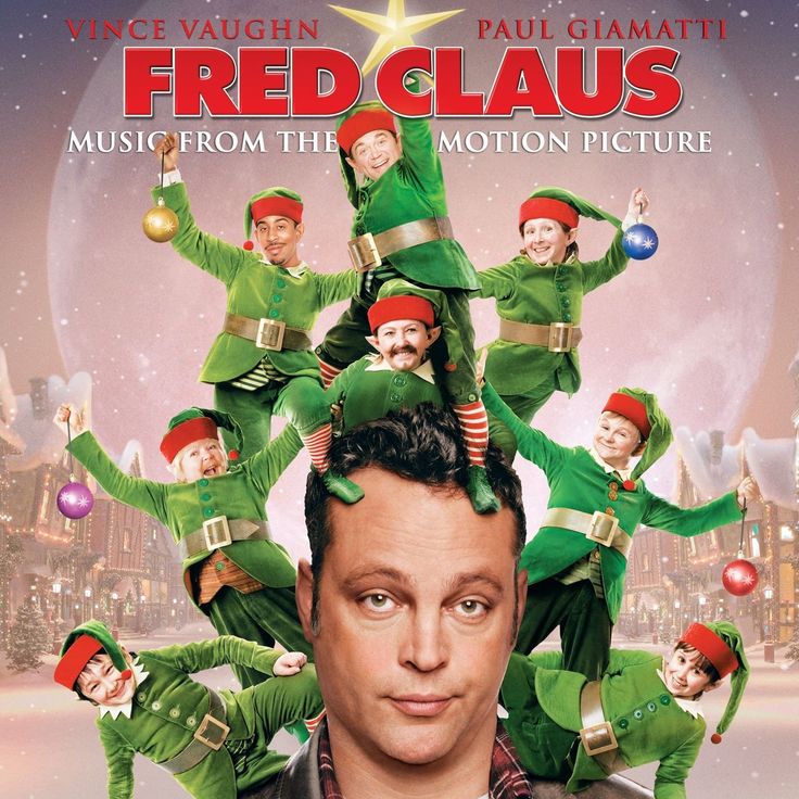 movie-poster-for-fred-claus-starring-vince-vaughn-showing-his-head-surrounded-by-small-elves-in-green-suits-holding-christmas-ornaments