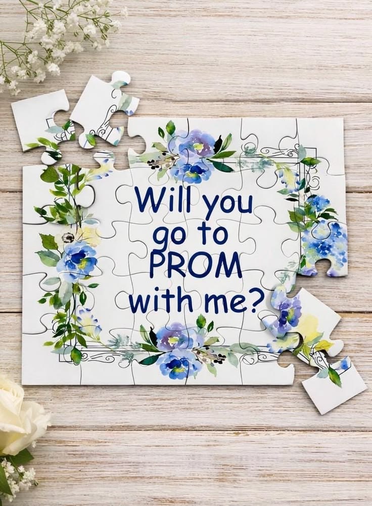custom-jigsaw-puzzle-promposal-with-floral-border-on-light-wood-background