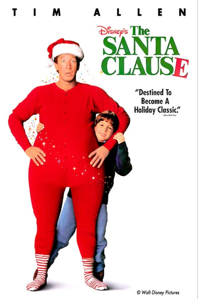 movie-poster-for-disneys-the-santa-clause-starring-tim-allen-wearing-red-long-johns-and-a-santa-hat-with-a-young-boy-hugging-him-from-behind