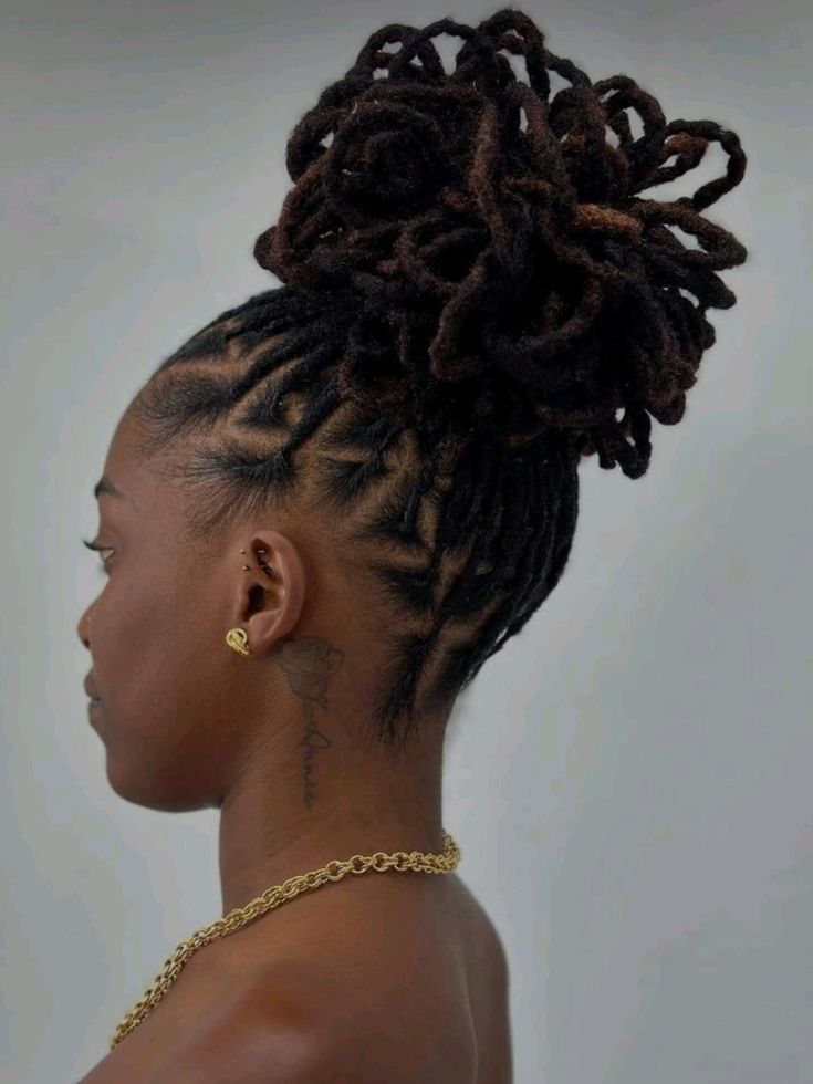 side-profile-of-a-woman-with-dark-locs-styled-in-a-high-voluminous-loc-puff